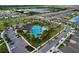 Aerial view of the community pool and amenities in a well-planned neighborhood at 3063 Marine Grass Dr, Wimauma, FL 33598