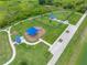 Aerial view of neighborhood park featuring playground and dog park, offering outdoor recreation at 31775 Sun Kettle Loop Loop, Wesley Chapel, FL 33545
