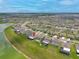 An elevated view of a residence within a community near a lake at 31775 Sun Kettle Loop Loop, Wesley Chapel, FL 33545