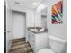 Contemporary bathroom featuring granite countertop and ample cabinet space at 31775 Sun Kettle Loop Loop, Wesley Chapel, FL 33545
