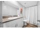 Bright bathroom with granite counters, white cabinets, and a shower/tub combo at 31775 Sun Kettle Loop Loop, Wesley Chapel, FL 33545