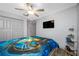 Bedroom featuring ceiling fan, wood-look flooring and closet at 31775 Sun Kettle Loop Loop, Wesley Chapel, FL 33545