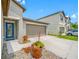 Charming home features a striking blue front door and a two-car garage at 31775 Sun Kettle Loop Loop, Wesley Chapel, FL 33545