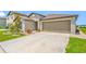 Well-maintained one-story home featuring manicured landscaping and a spacious driveway at 31775 Sun Kettle Loop Loop, Wesley Chapel, FL 33545