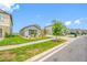 Charming single-story home featuring a well-manicured lawn and landscaping at 31775 Sun Kettle Loop Loop, Wesley Chapel, FL 33545