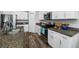 Clean kitchen featuring white cabinetry, stainless appliances, and granite countertops at 31775 Sun Kettle Loop Loop, Wesley Chapel, FL 33545