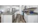 Bright kitchen with white cabinets, stainless steel appliances, and granite countertops at 31775 Sun Kettle Loop Loop, Wesley Chapel, FL 33545