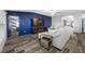 Comfortable living room boasting a stylish accent wall and open layout at 31775 Sun Kettle Loop Loop, Wesley Chapel, FL 33545