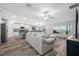 Inviting living area with an open floor plan, connecting to a modern kitchen at 31775 Sun Kettle Loop Loop, Wesley Chapel, FL 33545