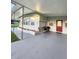 Covered back porch with swing and seating area, ideal for outdoor relaxation at 33516 Arthur Dr, Wesley Chapel, FL 33543