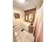 Neat bathroom featuring a vanity, mirrored wall cabinet, and tiled floors at 33516 Arthur Dr, Wesley Chapel, FL 33543