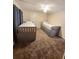 Cozy bedroom with two twin beds, carpet, and ceiling fan at 33516 Arthur Dr, Wesley Chapel, FL 33543
