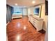 Bright bedroom featuring hardwood floors, a stylish dresser, and warm lighting at 33516 Arthur Dr, Wesley Chapel, FL 33543