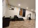 Spacious bonus room with ceramic floors, ample lighting, and gym equipment at 33516 Arthur Dr, Wesley Chapel, FL 33543