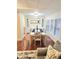 Dining room with hardwood floors, built-in shelving, and a large dining table for entertaining at 33516 Arthur Dr, Wesley Chapel, FL 33543