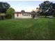 Welcoming single-story home with a covered carport and well-manicured lawn at 33516 Arthur Dr, Wesley Chapel, FL 33543