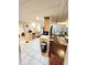 Open floorplan showcasing the kitchen with stainless steel dishwasher and adjacent living area at 33516 Arthur Dr, Wesley Chapel, FL 33543