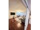 Inviting living room connected to the dining area, featuring hardwood floors and comfortable seating at 33516 Arthur Dr, Wesley Chapel, FL 33543
