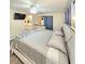 Comfortable main bedroom with ensuite bathroom, TV, and large windows at 33516 Arthur Dr, Wesley Chapel, FL 33543