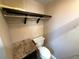 Bathroom with toilet, vanity and rack shelf at 3654 Corsair Ct, New Port Richey, FL 34652