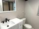 Bathroom with white vanity, black hardware, and tiled shower at 3654 Corsair Ct, New Port Richey, FL 34652