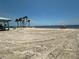 Sandy beach with ocean views and a picnic area nearby at 3654 Corsair Ct, New Port Richey, FL 34652