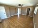 Open bedroom with laminate floors, a ceiling fan, and neutral colored walls at 3654 Corsair Ct, New Port Richey, FL 34652