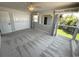 Bright bedroom with neutral carpet, closet, and windows that provide natural light and outdoor views at 3654 Corsair Ct, New Port Richey, FL 34652