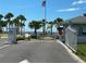 Gated community entrance near the beach with palm trees and a serene coastal atmosphere at 3654 Corsair Ct, New Port Richey, FL 34652