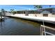 Waterside residence showcases dock for effortless waterfront living and recreation at 3654 Corsair Ct, New Port Richey, FL 34652