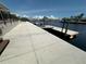 Long concrete dock extending into the water, providing access for boating and water activities at 3654 Corsair Ct, New Port Richey, FL 34652