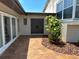 Inviting front entrance features double doors, neutral paint, and manicured landscaping at 3654 Corsair Ct, New Port Richey, FL 34652