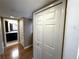 Hallway features closet doors and views of the bathroom and other rooms at 3654 Corsair Ct, New Port Richey, FL 34652