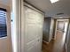 Hallway featuring closet doors and views of additional rooms at 3654 Corsair Ct, New Port Richey, FL 34652