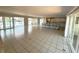 Open concept living room with access to kitchen, water views, and plenty of natural light at 3654 Corsair Ct, New Port Richey, FL 34652