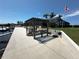 This home's patio is perfect for outdoor relaxing with a firepit and seating at 3654 Corsair Ct, New Port Richey, FL 34652