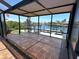 Covered outdoor patio with tile flooring providing beautiful waterfront views and boat dock access at 3654 Corsair Ct, New Port Richey, FL 34652