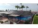 An outdoor screened pool area with a beautiful clear pool at 3654 Corsair Ct, New Port Richey, FL 34652
