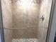 Shower with tile surround and glass door at 3654 Corsair Ct, New Port Richey, FL 34652