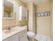 Bathroom features a vanity with cabinet storage and a combined shower/tub at 36750 Beth Ave, Zephyrhills, FL 33542