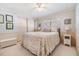 Bright bedroom with neutral color scheme, ceiling fan, and built-in closet at 36750 Beth Ave, Zephyrhills, FL 33542
