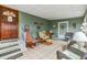 Living area with natural light, comfortable seating, and warm, wooden accents, creating an inviting and airy atmosphere at 36750 Beth Ave, Zephyrhills, FL 33542