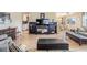 Open living room with a media center, comfortable seating and an adjacent dining area at 36750 Beth Ave, Zephyrhills, FL 33542