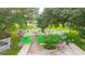 Aerial view of the whimsical mini golf course with decorative features and mature trees offering ample shade at 36750 Beth Ave, Zephyrhills, FL 33542