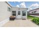 Outdoor patio with a grill and direct access to the outside featuring a welcoming door and ample natural light at 36750 Beth Ave, Zephyrhills, FL 33542