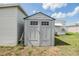 Well-maintained outdoor storage shed with a green roof, providing secure and accessible storage space on the property at 36750 Beth Ave, Zephyrhills, FL 33542