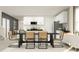 Bright, open concept dining room features a stylish dining table and flows into the modern kitchen area at 3710 Forest Path Dr, Plant City, FL 33565