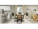 Elegant dining area featuring a modern table, stylish chairs, and natural light, ideal for gatherings and meals at 3710 Forest Path Dr, Plant City, FL 33565