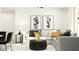 Bright living room with sectional sofa, modern art prints, and elegant decor at 3710 Forest Path Dr, Plant City, FL 33565