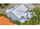 Aerial view of the home showcasing the metal roof, backyard, and surrounding neighborhood at 4311 W Sevilla St, Tampa, FL 33629